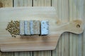 raw tempeh. soybeans and sliced Ã¢â¬â¹Ã¢â¬â¹raw tempeh on a wooden board